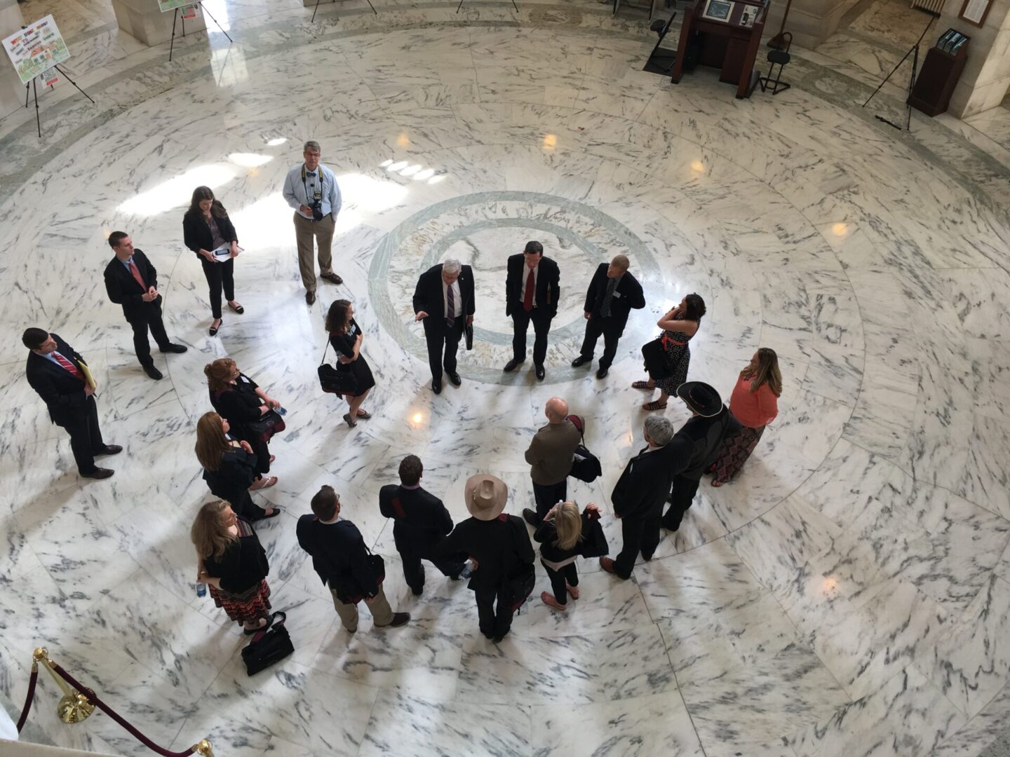 A group of people standing in the center of a circle.
